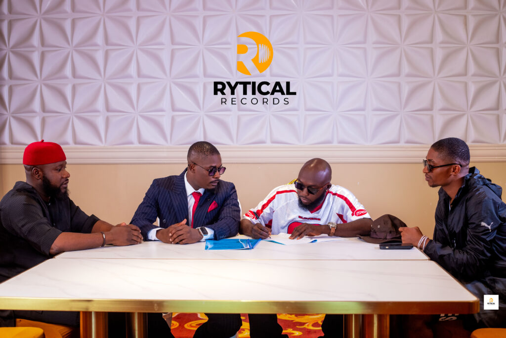 Germani signing the record deal